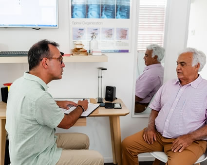 chiro talking male client